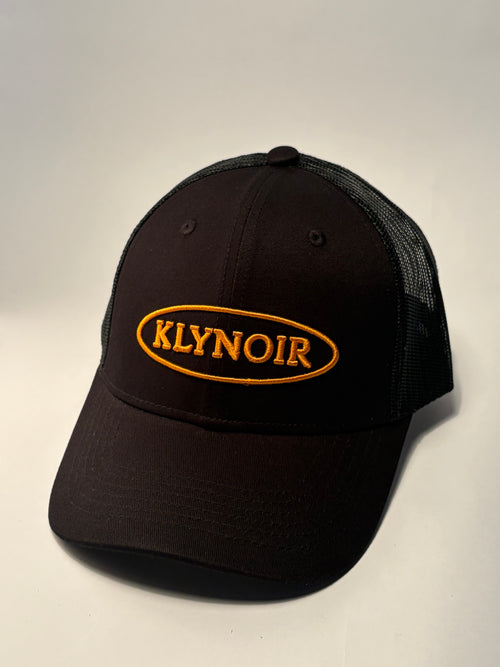 KLYNOIR Black Cotton Trucker Cap with Orange Oval Patch