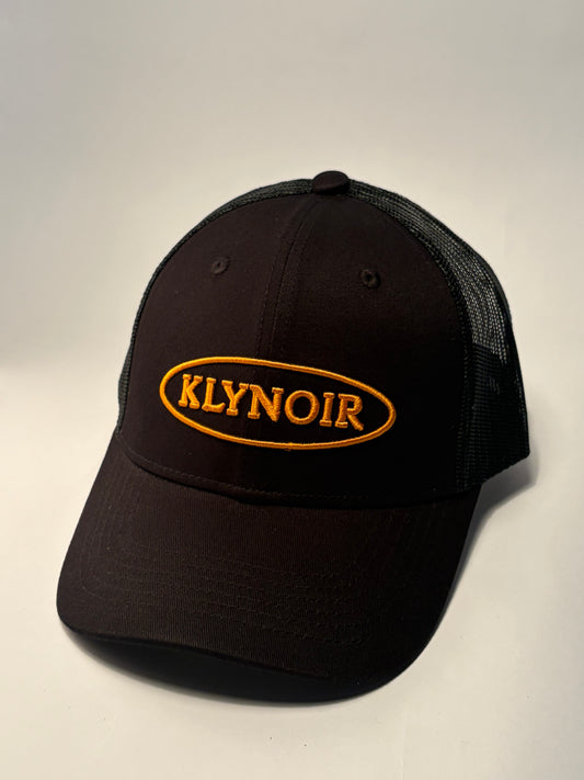 KLYNOIR Black Cotton Trucker Cap with Orange Oval Patch